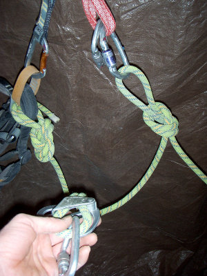 Taking the belay device off the anchor and…